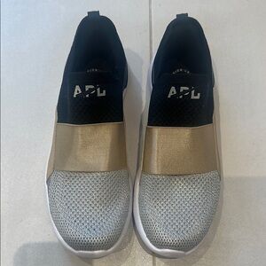 APL Metallic Gold and Black Slip-On Sneakers